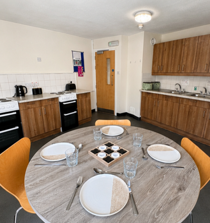 Communal kitchen with dining table view 2